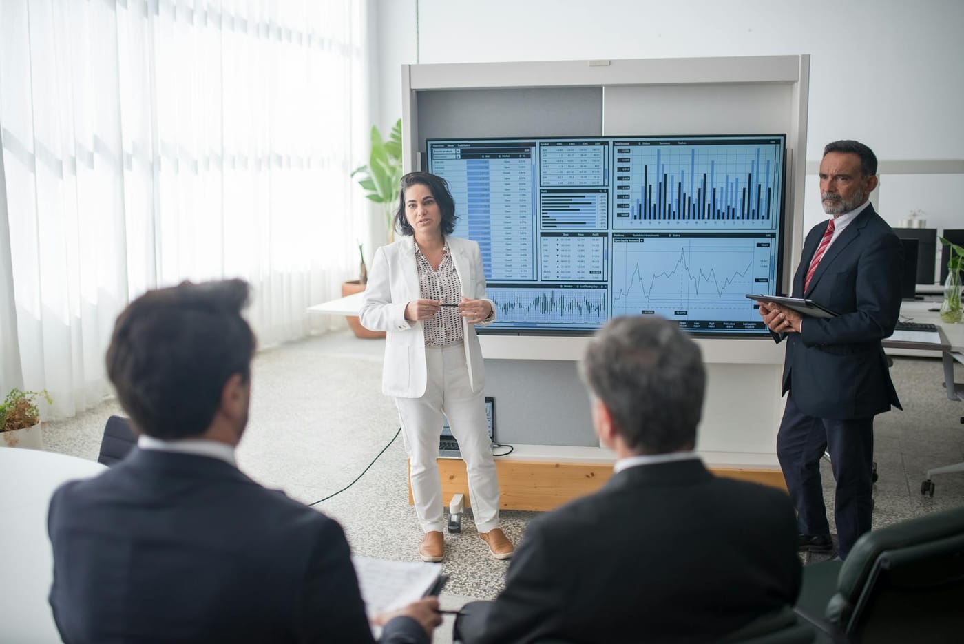 Consultant presenting analytics dashboards
